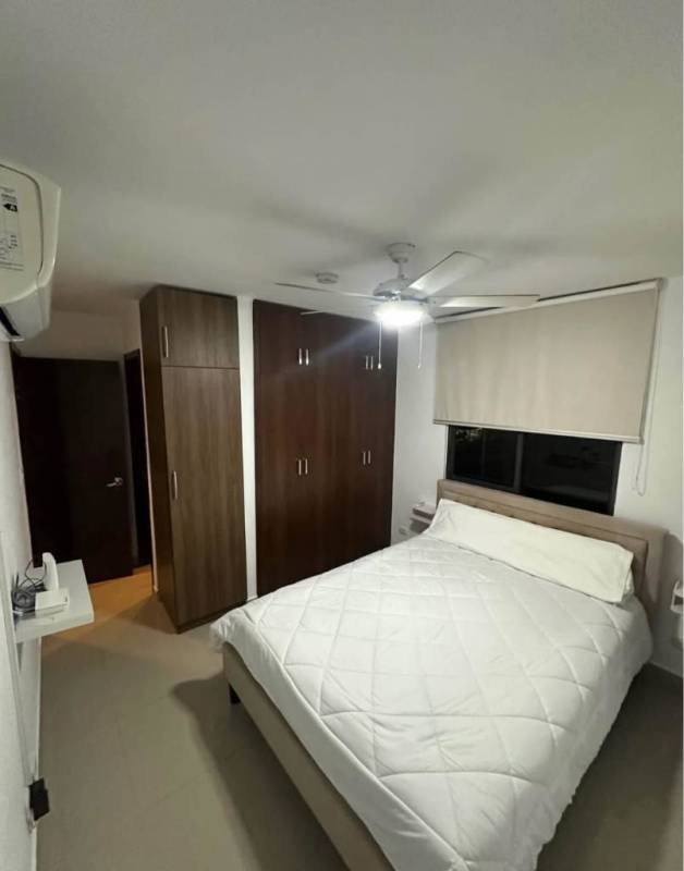 Open living dining area with access to covered balcony in PH Vista Tower near Metro Panama