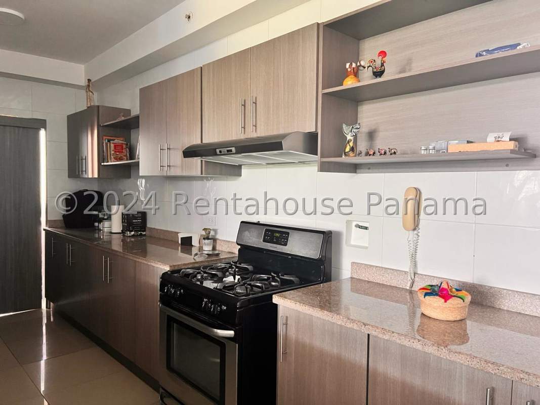 Kitchen with granite countertops, stylish cabinetry in PH Cangrejo Bay El Cangrejo Panama