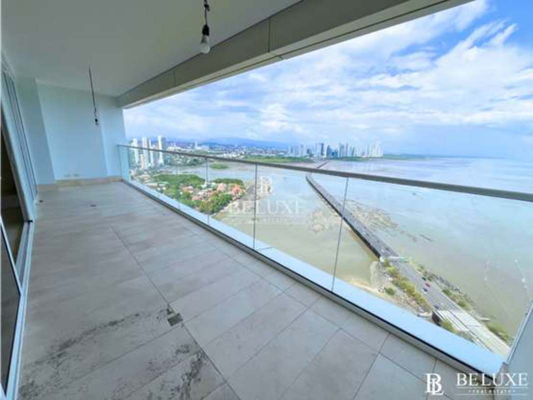 Spacious living room with floor-to-ceiling windows and panoramic views at PH Windrose Coco del Mar Panama