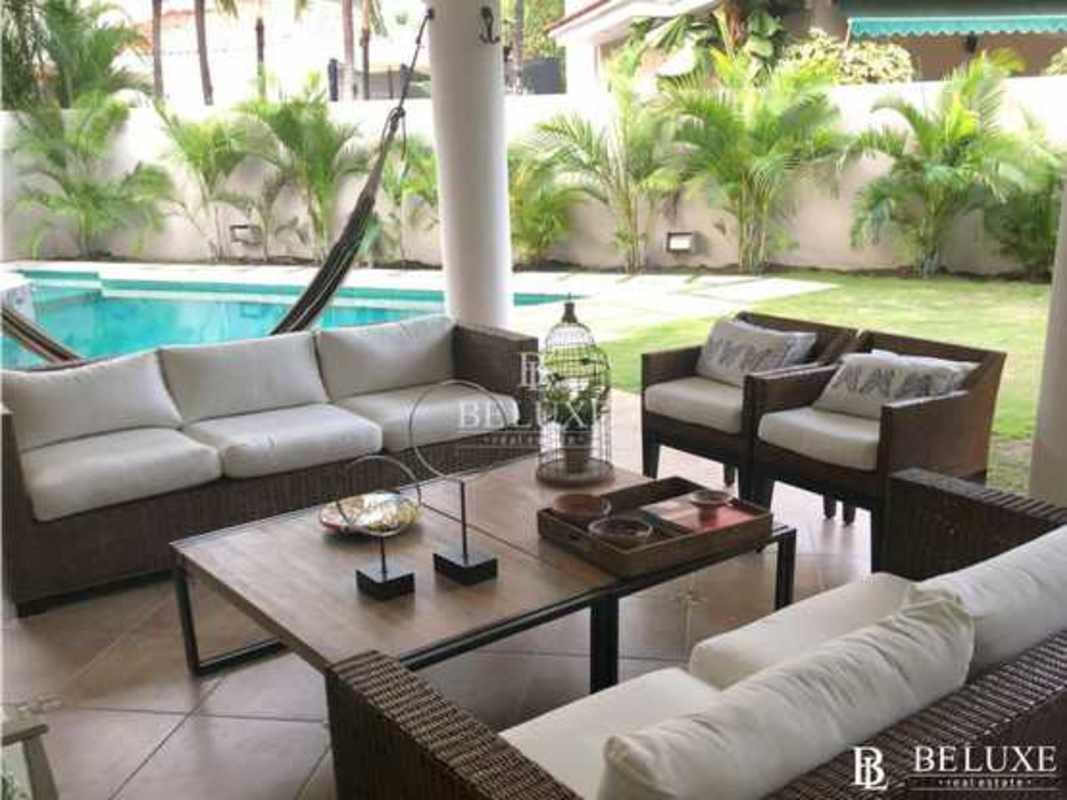 Elegant living room with marble floors and garden view luxury house Costa del Este