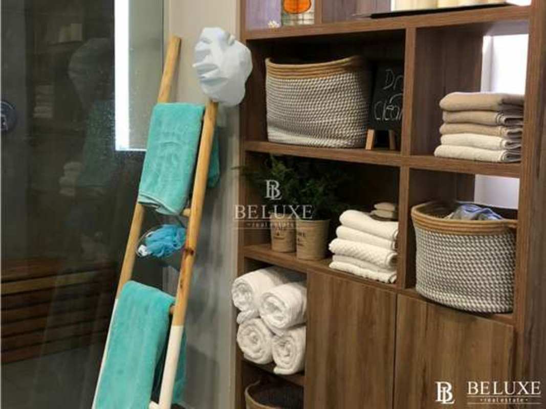 Spacious dining room with chandelier marble floors in Costa del Este home