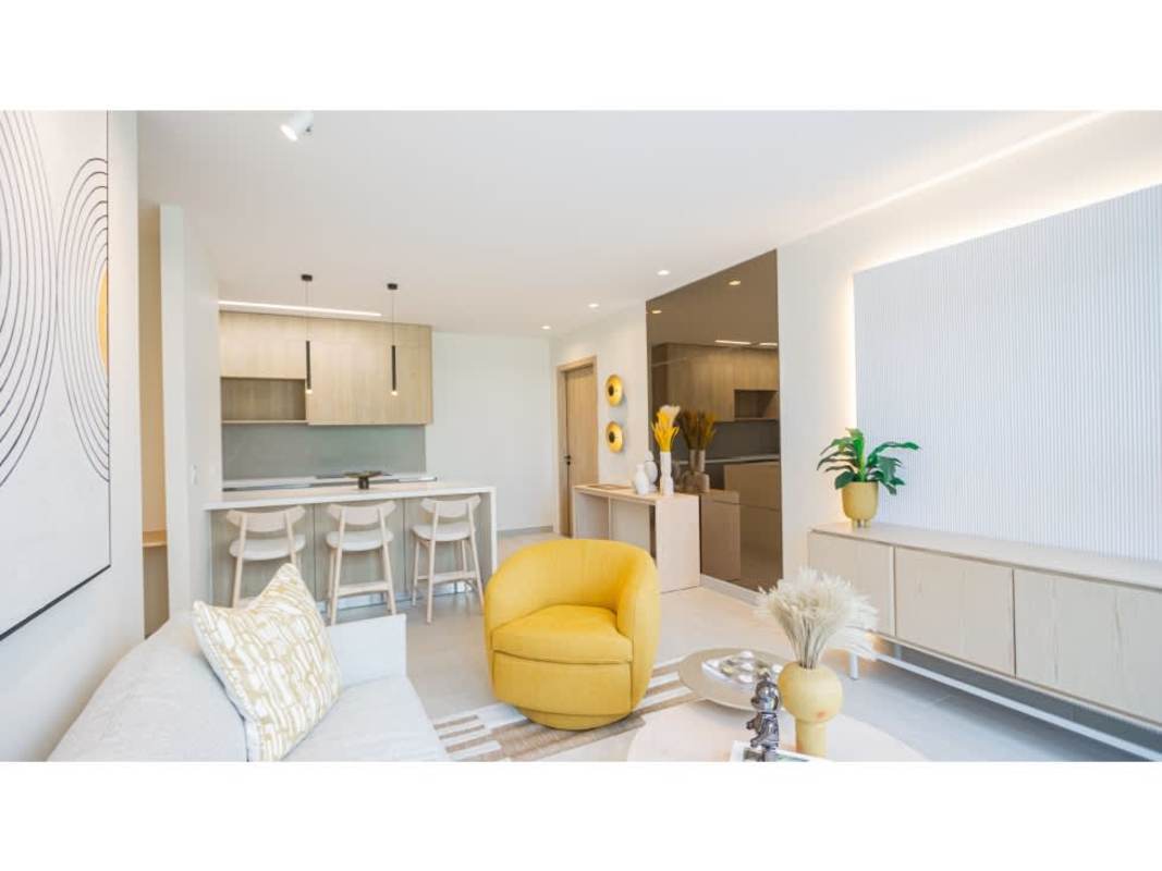 Sleek modern kitchen with island, light wood cabinetry, hexagon tile backsplash Costa del Este Panama