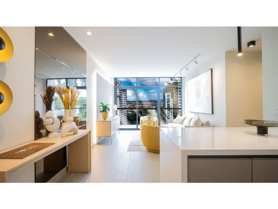 Modern master bedroom with large window, ensuite, and walk-in closet PH Nogal Panama City