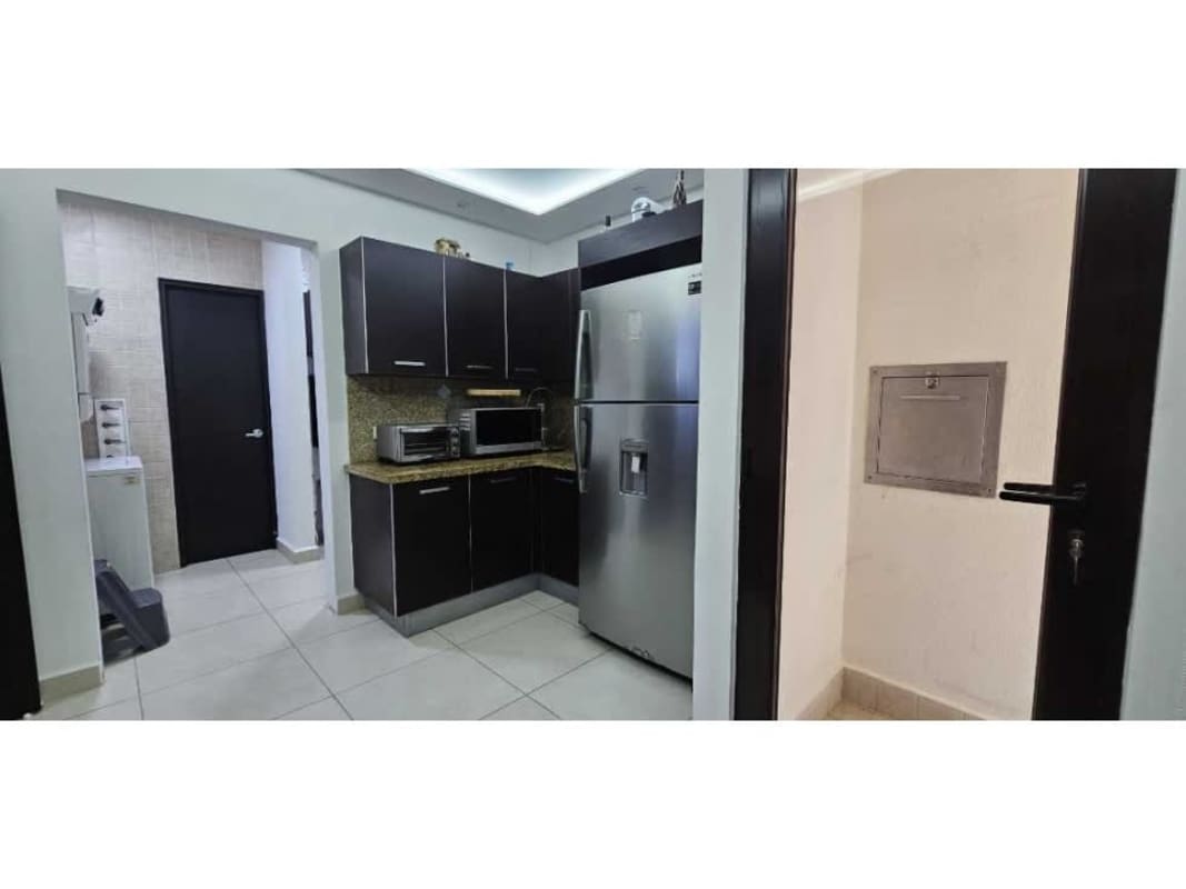 Modern granite countertop kitchen with stainless appliances at PH Embassy Village Panama
