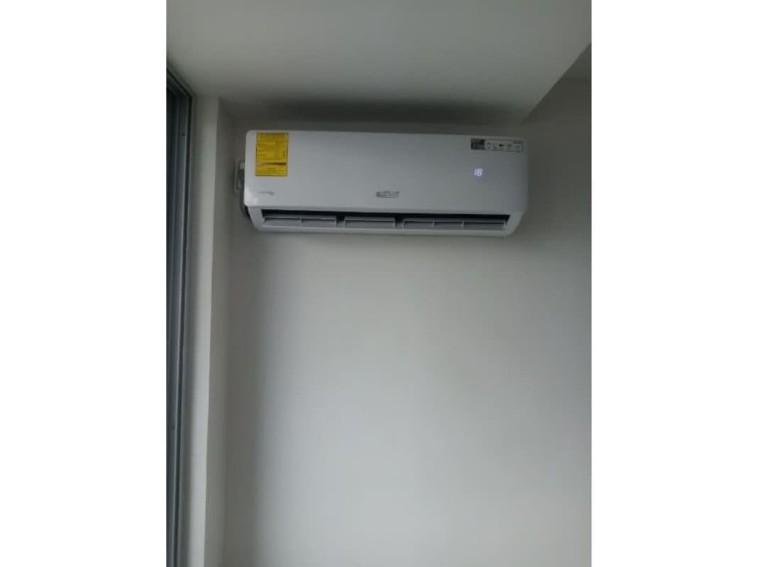 Bedroom with large window city view in PH Solok Parque Lefevre Panama