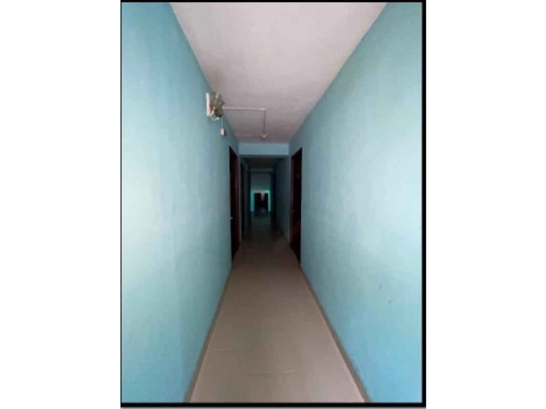 Corridors with multiple doors and rental units inside investment property Calidonia Panama