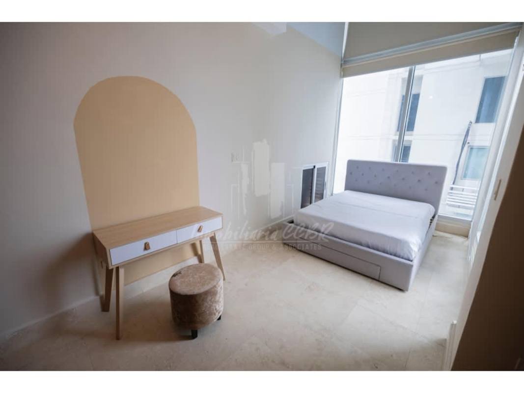 Open modern kitchen with island bar stools in Loft Four 41 Panama