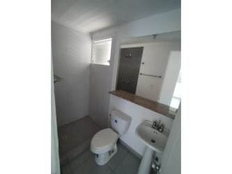 Colorful children's playground surrounded by gardens in PH La Sierra Club Residencial