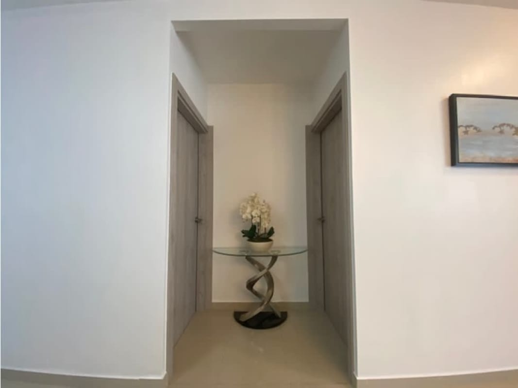 Open kitchen with granite counters, breakfast bar, and appliances in PH Premium Tower Panama City