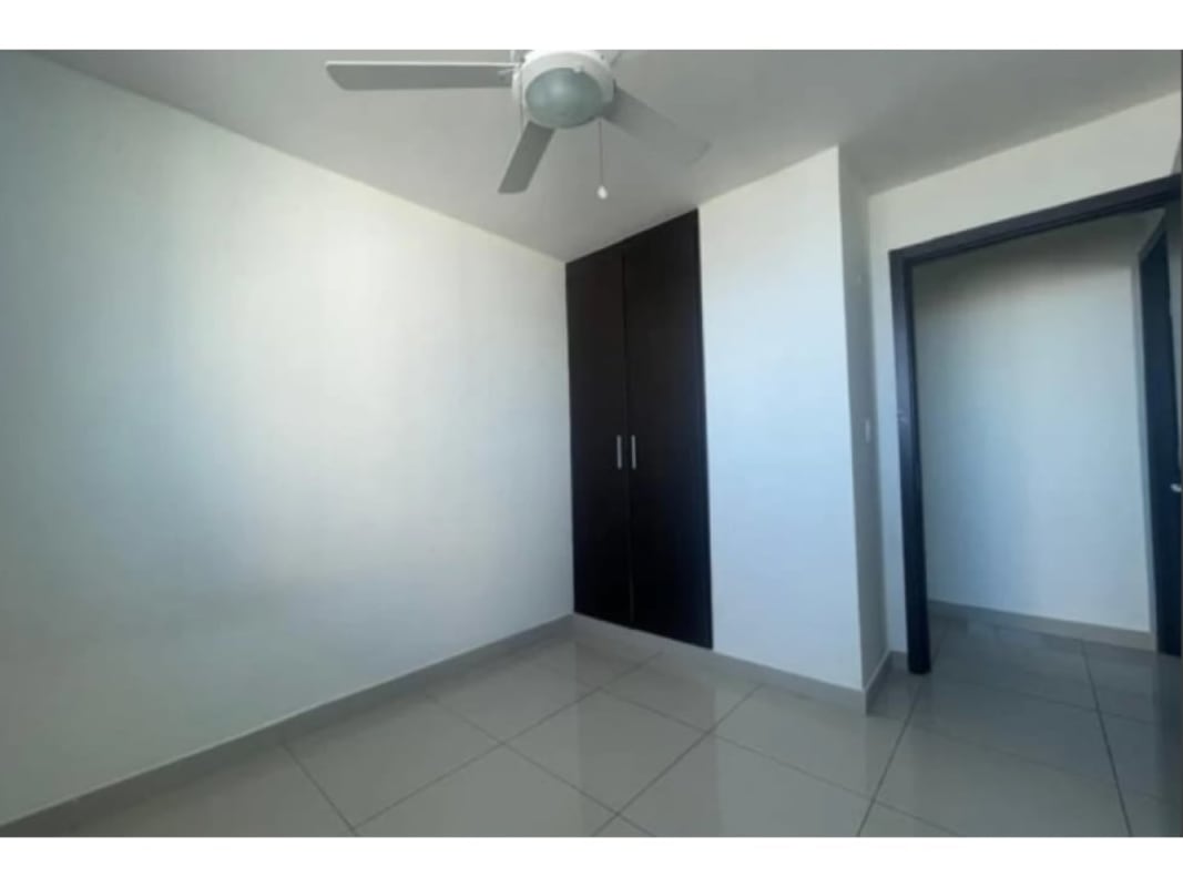 Empty bedroom with modern cabinetry and ceiling fan PH Victoria Royale Panama
