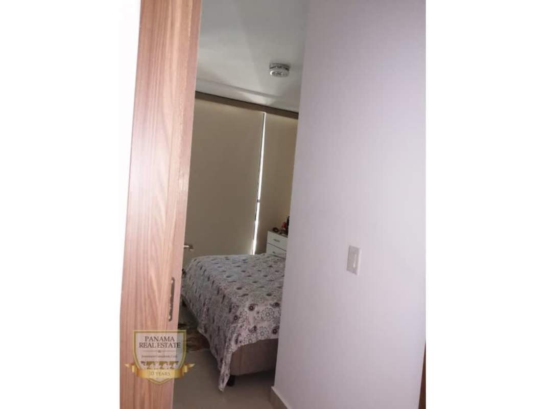 Bright bedroom with AC and tufted headboard in PH Downtown Obarrio Panama furnished rental