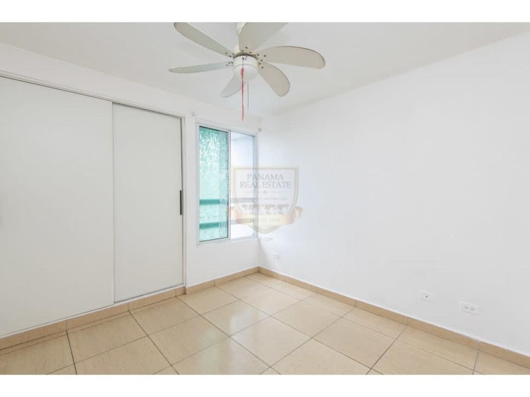 Bedroom with window, tile flooring, ceiling fan in PH Carrasquilla Residence Panama City