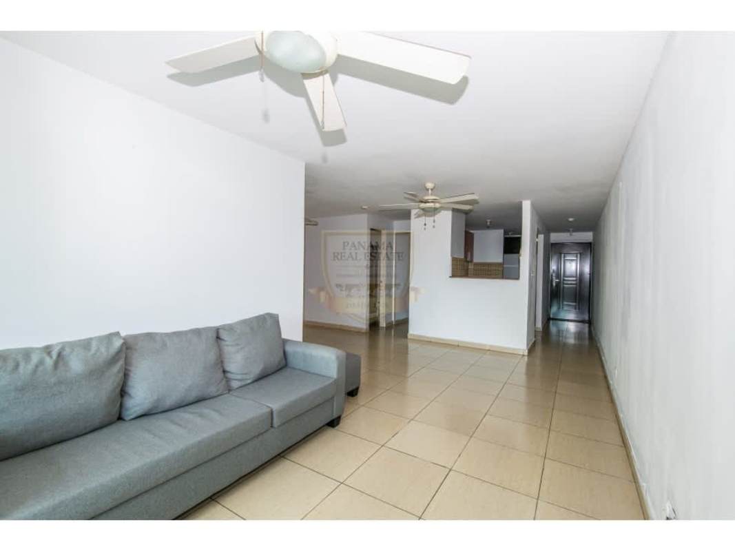 Spacious living-dining room with neutral tones and ceiling fans in Carrasquilla Panama