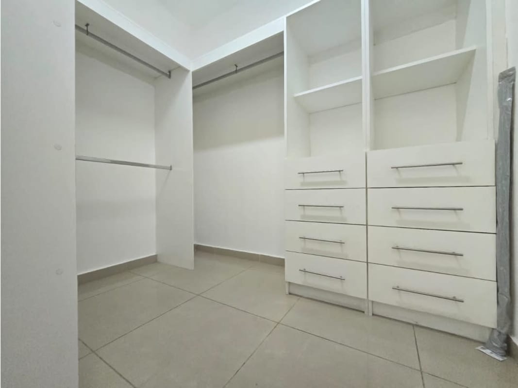 Modern bathroom with glass shower and granite counter in luxury Punta Pacífica apartment