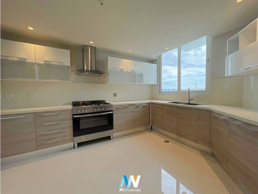 Modern gym with cardio equipment, weights and panoramic windows at PH The Regent Costa del Este Panama