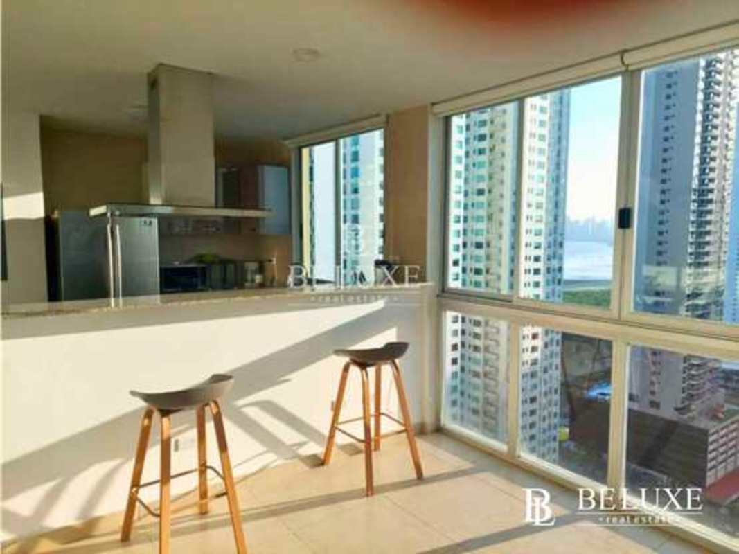 Living room with natural light, floor-to-ceiling windows and balcony ocean view in PH Lumiere Costa del Este Panama