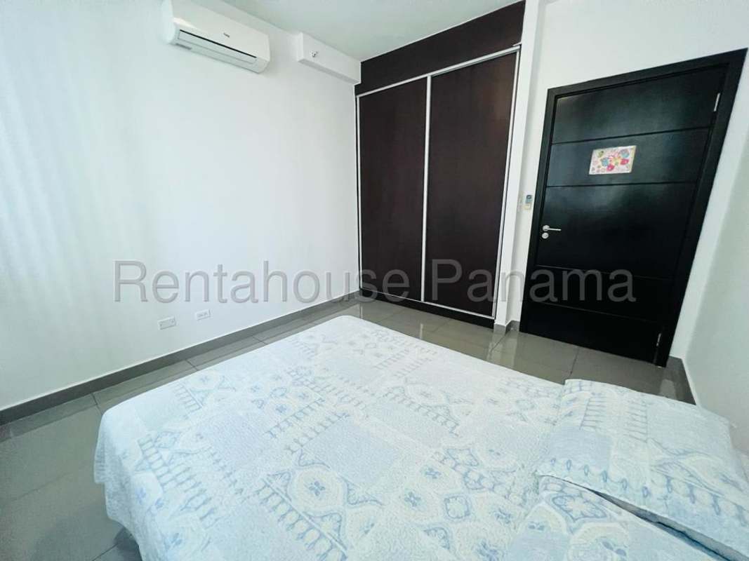 Second bedroom with built-in closet, split AC, tiled floor in PH Quartier 74