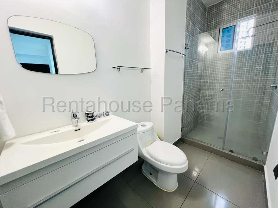 Contemporary kitchen with white cabinetry, granite countertops, appliances, PH Quartier 74 San Francisco Panama