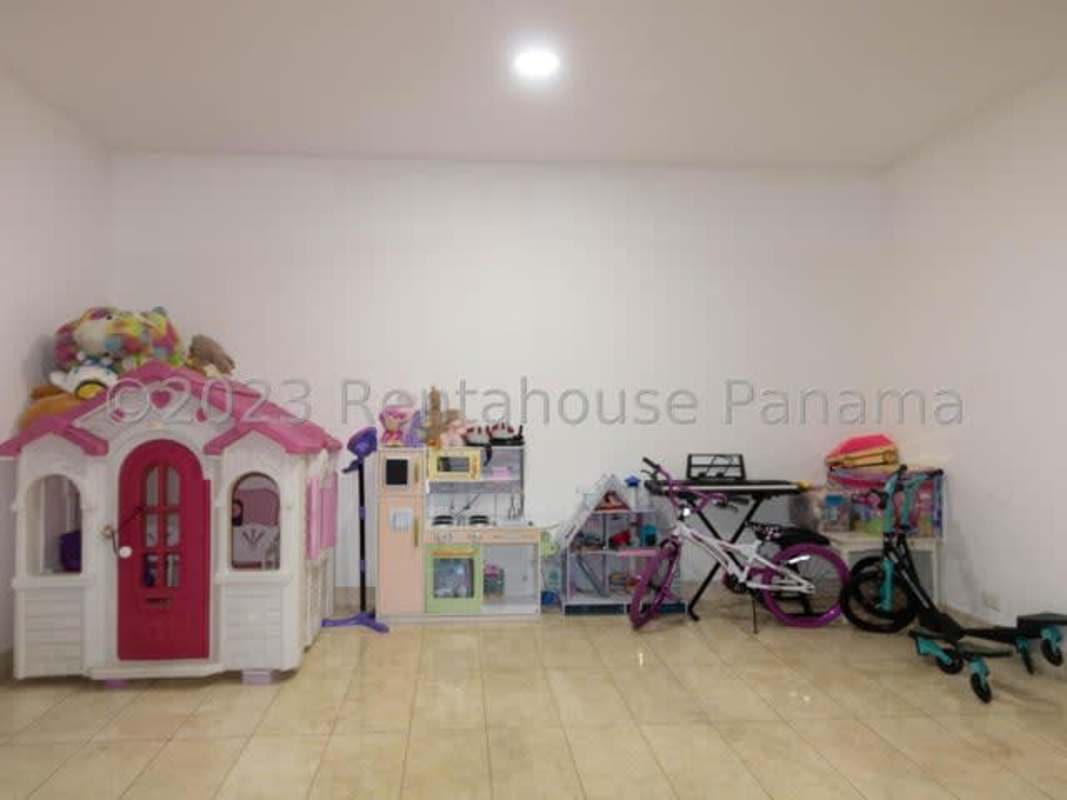 Playroom with toys and large windows inside PH Santorini Panama City residence