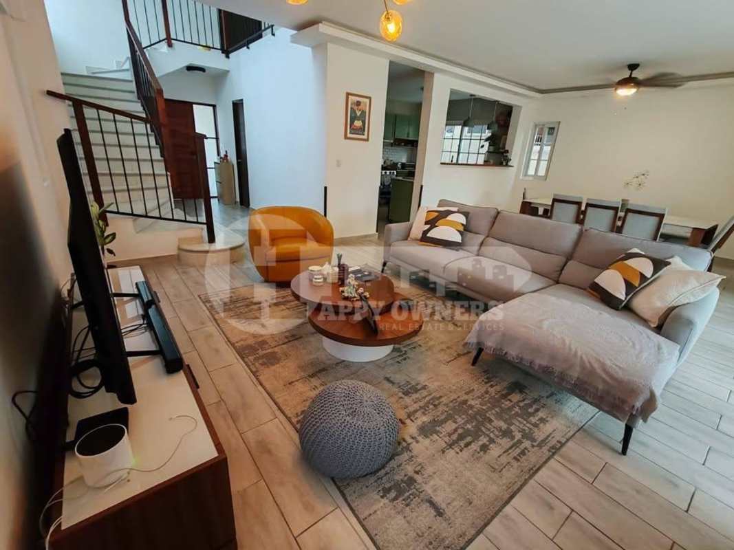 Large swimming pool with lounge area tropical landscaping Villa Valencia Costa Sur Panama