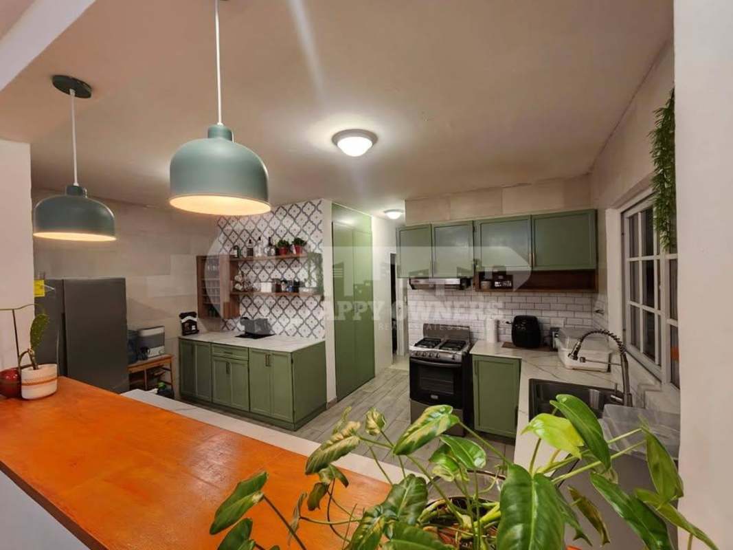 Spacious open-plan living room dining area with blue LED lighting Villa Valencia Panama