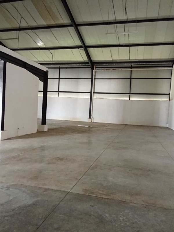 Interior of commercial warehouse showing steel beams and concrete floor Pacora Panama