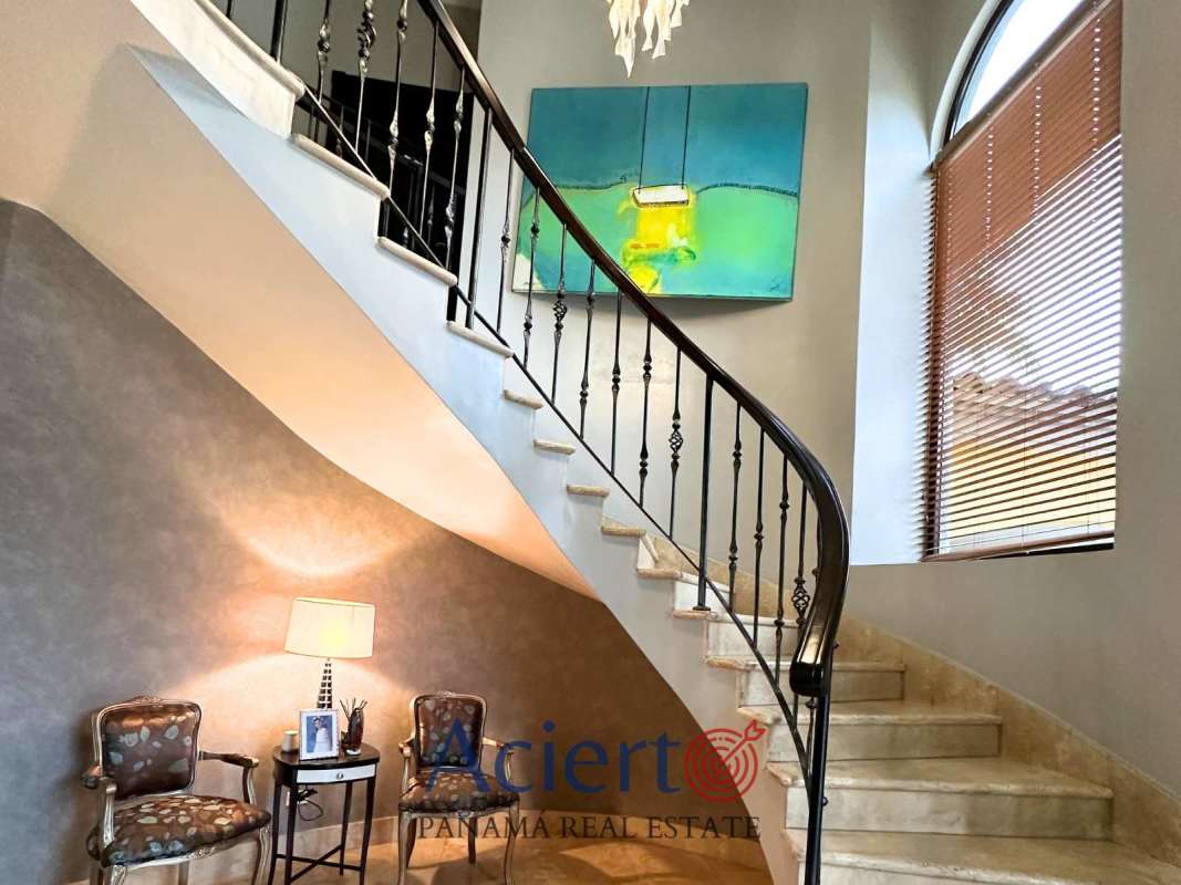 Spacious living room with sectional sofa, arch doorways to pool-terrace, elegant decor Costa del Este Panama