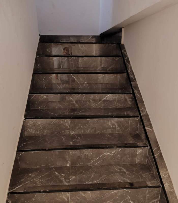 Partially constructed open space with accent tile wall gas line and exposed ceiling at Plaza San Francisco