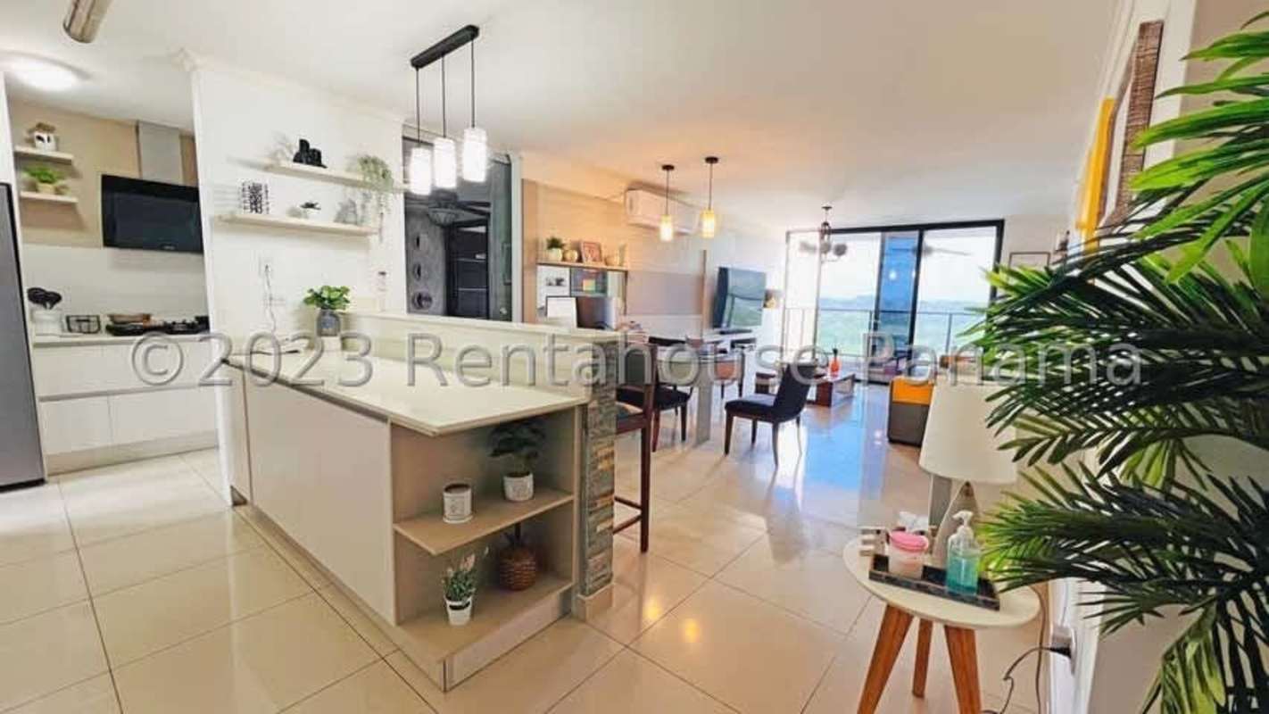 Granite countertop kitchen with stone breakfast bar and modern cabinetry PH Portofino Panama City