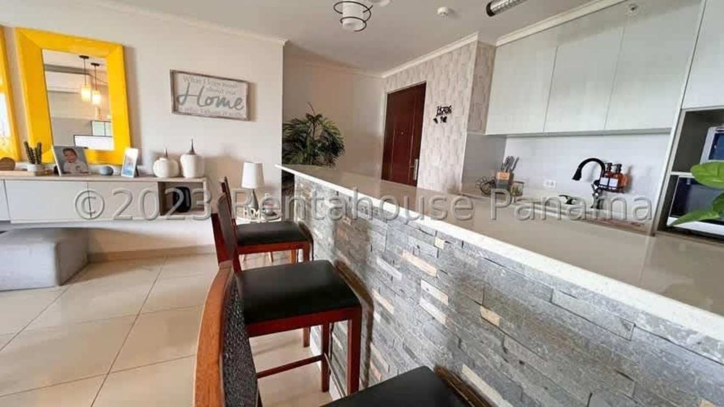 Modern open kitchen with breakfast bar and pendant lighting PH Portofino Villa de las Fuentes Panama