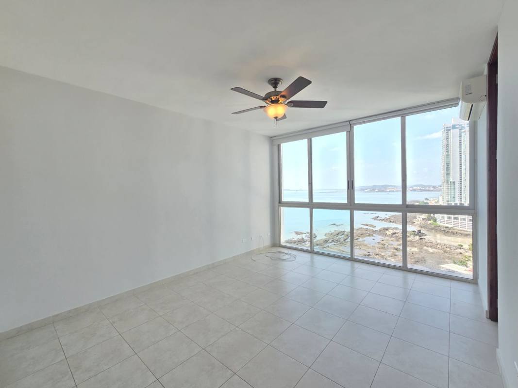 Luxurious lobby with double height roof, modern design and concierge desk at PH Aqualina Punta Pacifica