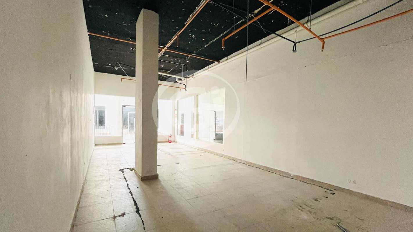 Second floor commercial retail spaces with glass facades inside Bella Vista Plaza near La Cresta Panama