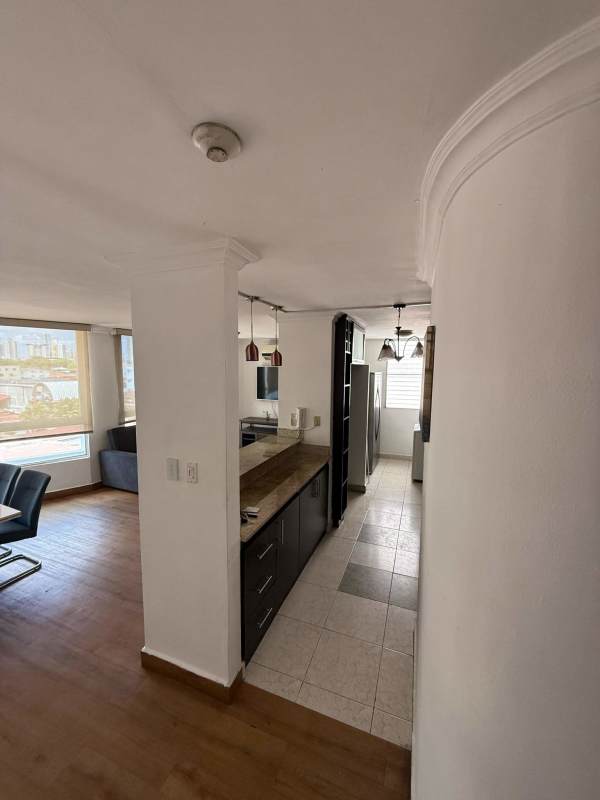 Master bedroom with ensuite bathroom, walk-in closet, blue bedding at PH St. Emillion Panama apartment for rent