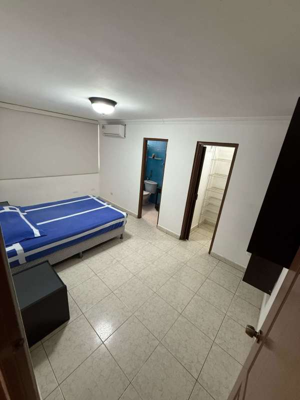 Spacious walk-in closet with wire shelving in PH St. Emillion master bedroom Panama City apartment