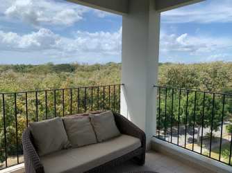 Bright bedroom with closet and large window at PH Ensenada Beach Resort San Carlos Panama