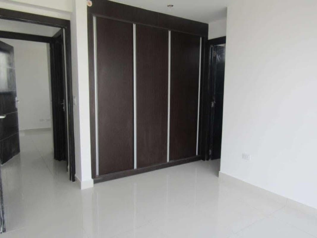 Modern gym with cardio machines and weight training area at PH Carreras Panama City