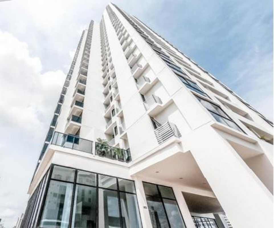 Modern condominium building PH Carreras with glass balconies and high-rise facade in El Carmen Panama City