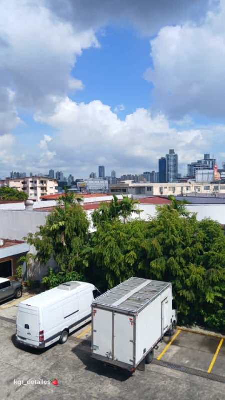 Contemporary bathroom with glass shower, beige tile and toilet in PH Baleares Panama