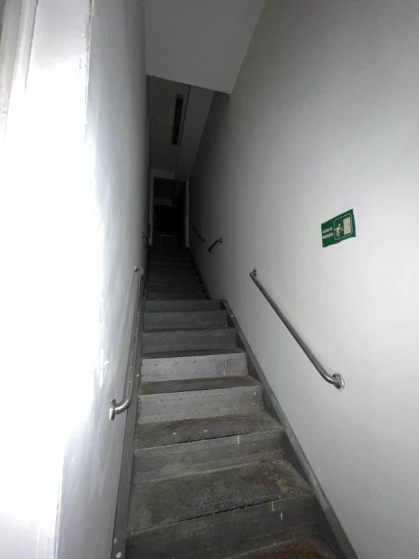 Large open commercial interior with tiled floor in Condado del Rey rental unit