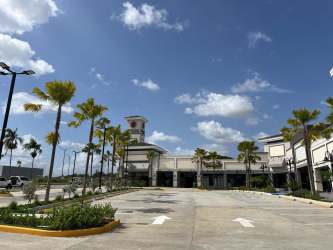 Commercial shopping plaza clock tower Mediterranean revival style at Costa Verde La Chorrera
