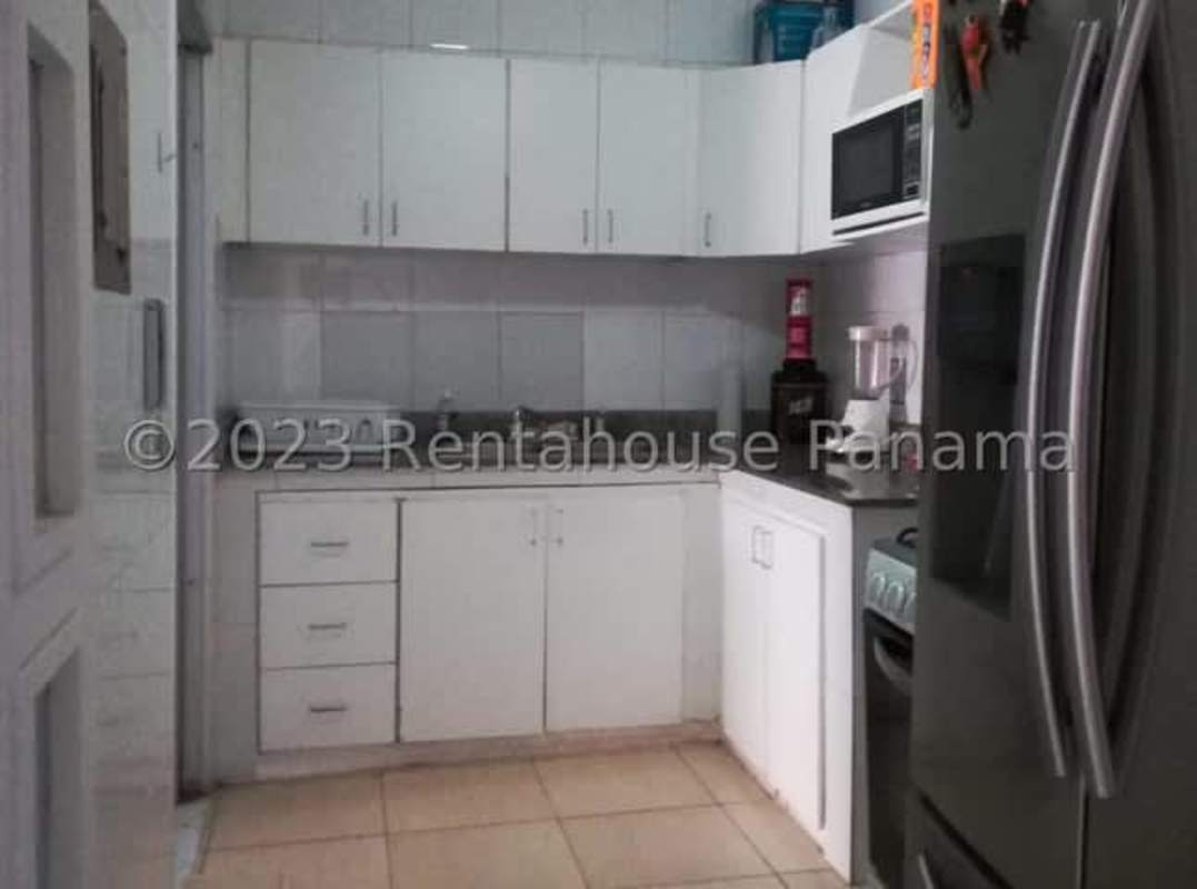 Kitchen with white cabinets, ceramic counters and space for appliances in PH Cristal Park El Cangrejo Panama City