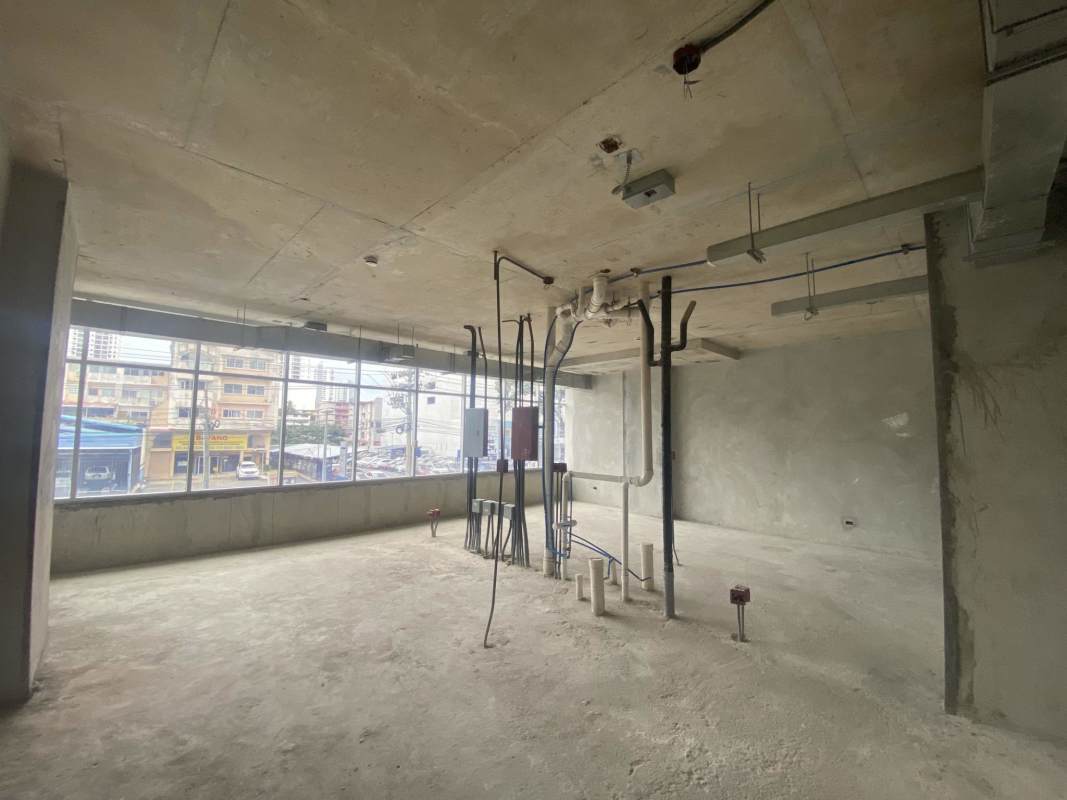 Raw commercial unit shell with windows ready for customization at medical center Panama