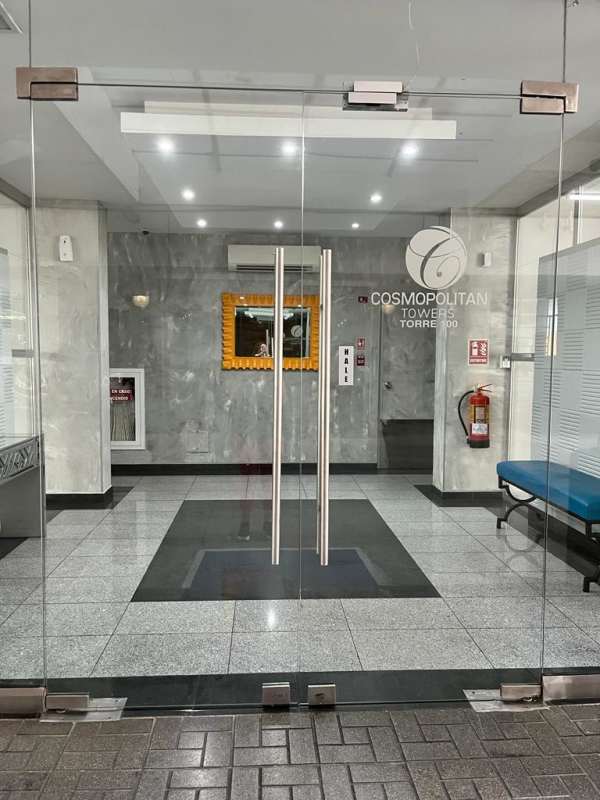 Spacious lobby entrance with glass doors and marble walls in Cosmopolitan Tower Panama