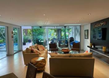 Covered patio terrace with dining and lounge near pool in Coronado villa rental