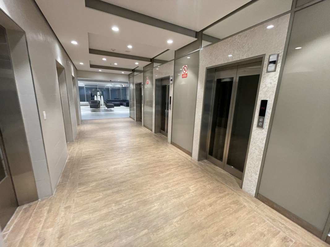 Elevator lobby area with multiple elevators and modern decor in Town Center Panama