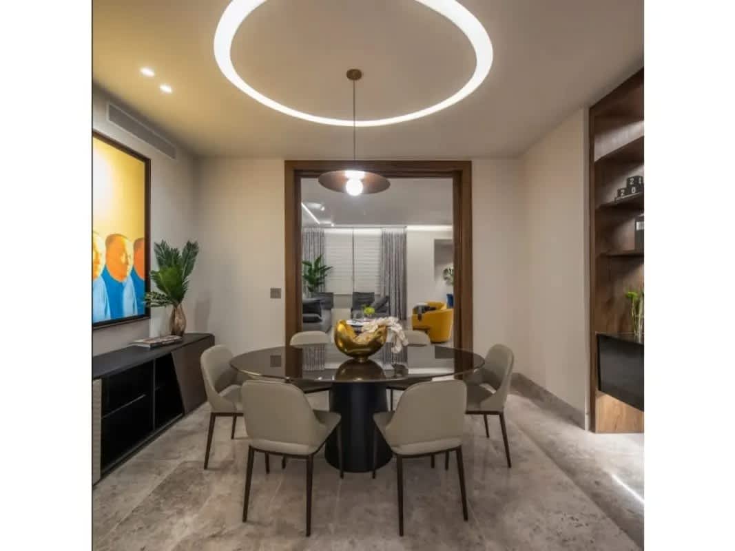 Modern bedroom with large windows, city skyline views, marble floors at PH Sea Point Punta Paitilla