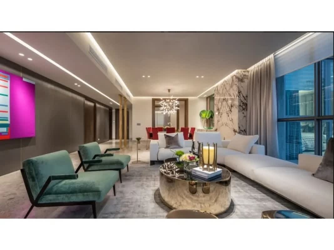 Modern dining area with glass table, marble floors at PH Sea Point Punta Paitilla Panama