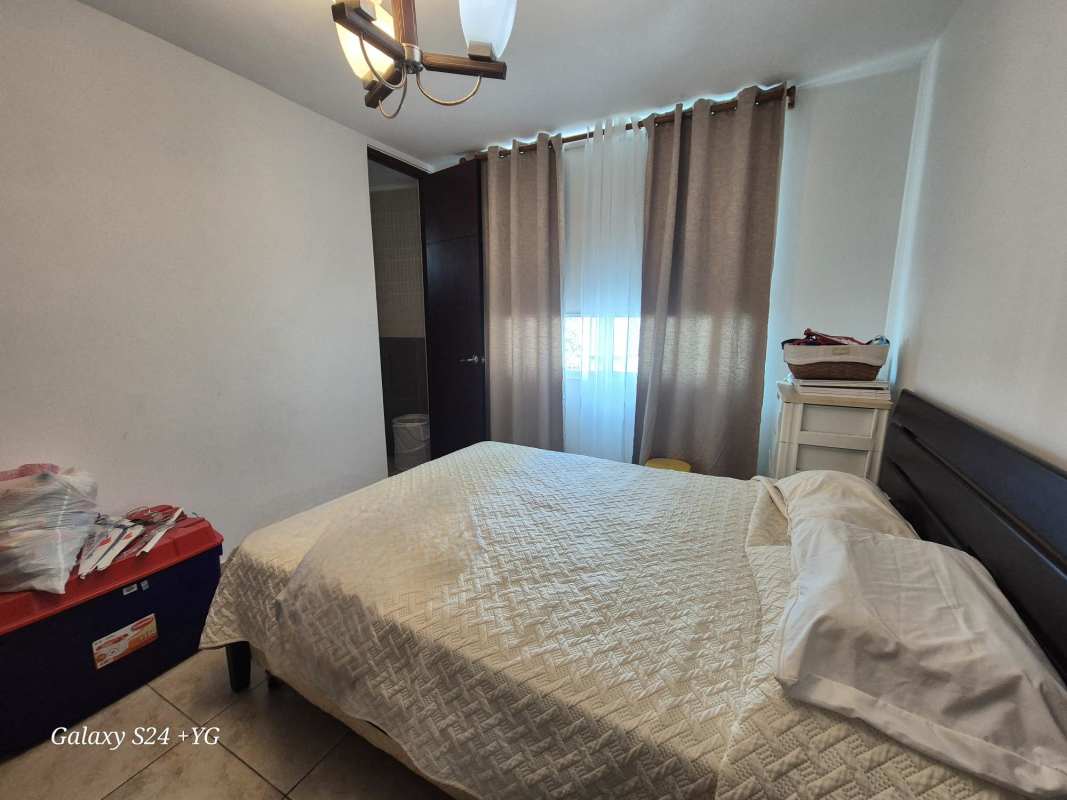 Bedroom with tile floors, ensuite bathroom, window view in PH 7400 San Francisco Panama