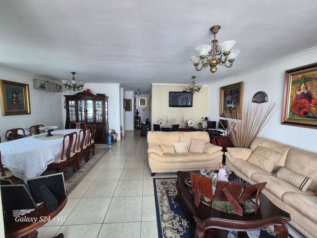 Large traditional living and dining area with tile floors and chandelier PH 7400 Panama City