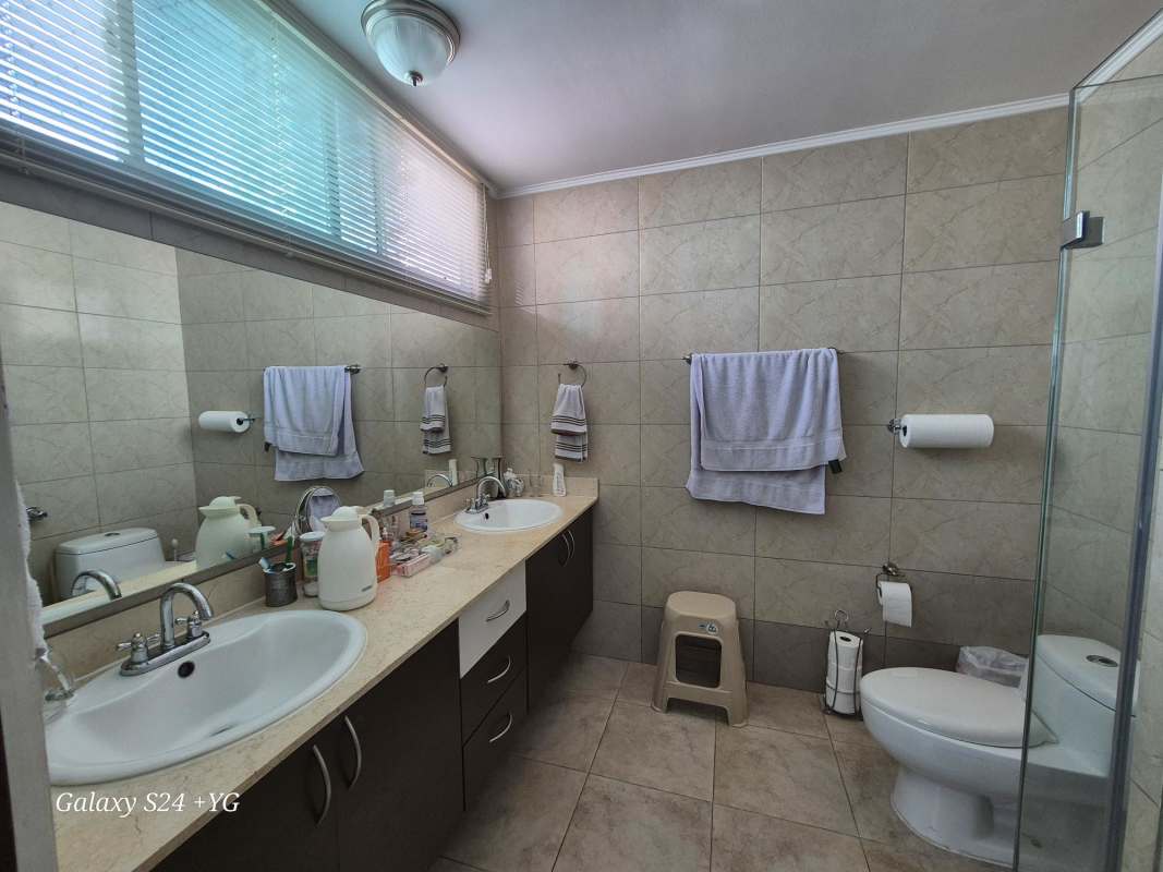 Bathroom featuring double sink, glass shower, tile finishes PH 7400 San Francisco Panama